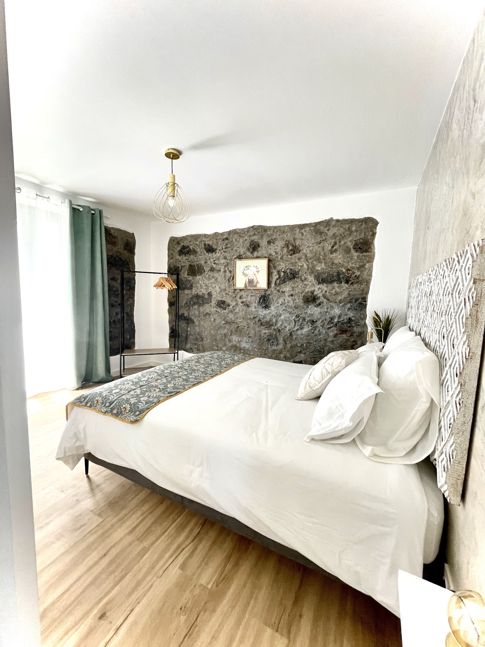 Modern bedroom with stone textures and soft natural light